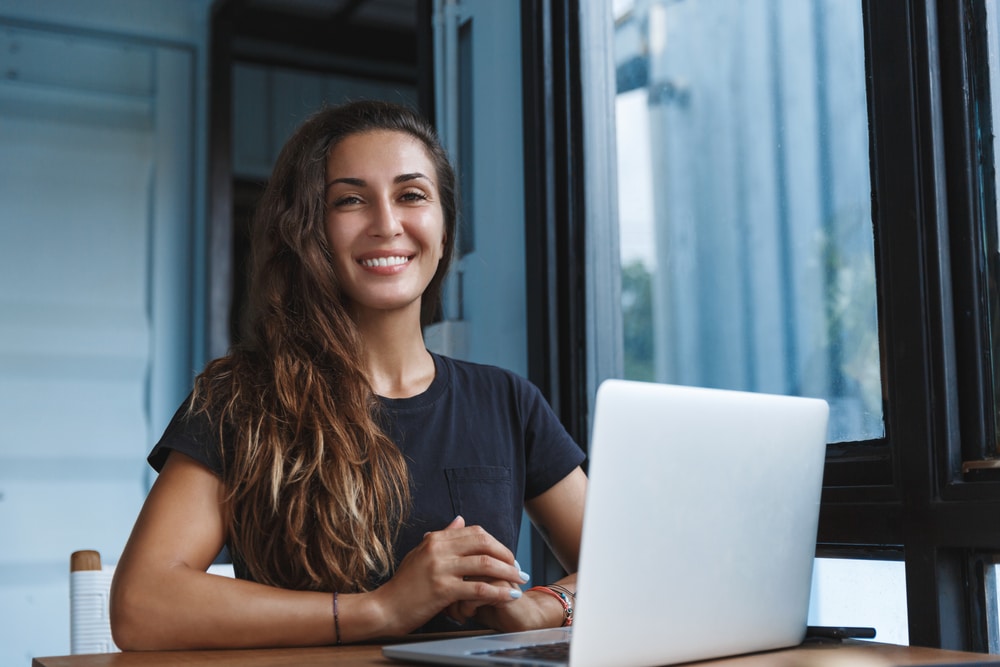 Girl With Laptop Smiling